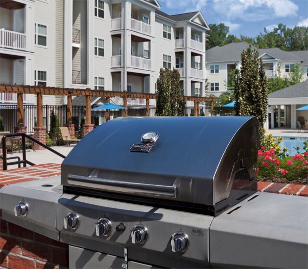 cary apartments 27519 - Chancery Village Pool deck featuring multiple gas grills