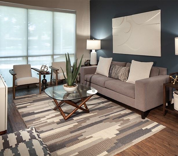 Greenbriar apts - Houston, TX - District at Greenbriar Living room with vinyl plank flooring