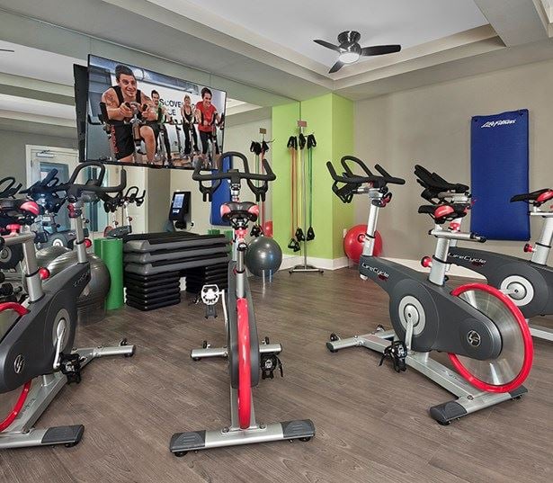Marshall Park apartments 27612 - Fitness theater - virtual trainer spin bikes steps weights