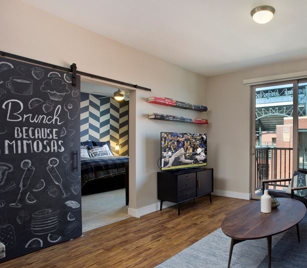 The Battery on Blake Street model living room - Studios near the Ballpark, CO