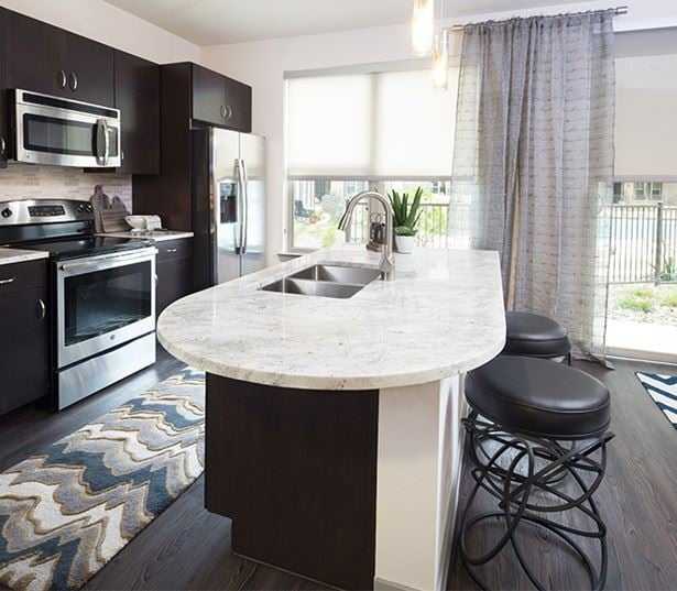 The Addison Apartments in the Domain - Granite countertops and espresso cabinets 