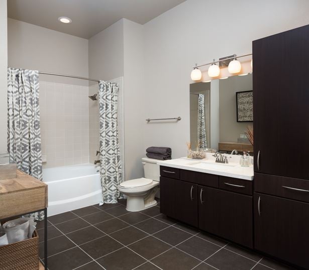 Apartments near 77098 - District At Greenbriar Limestone countertops vanities