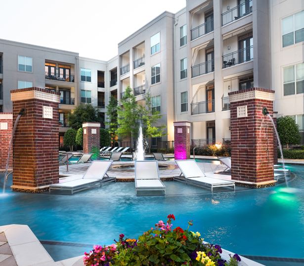 The Icon at Ross swimming pool with night pool lights - Uptown Dallas Apartments