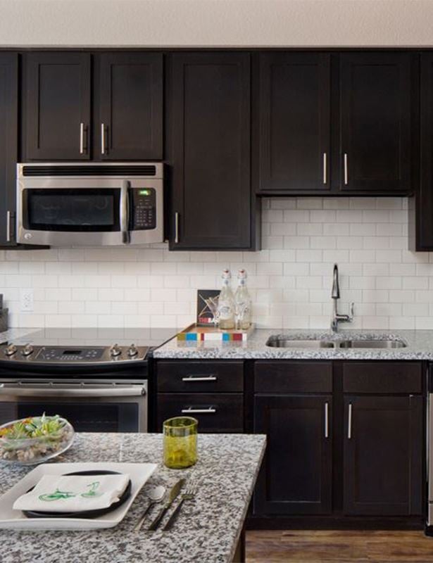 The Battery on Blake Street model kitchen - apartments near union station denver