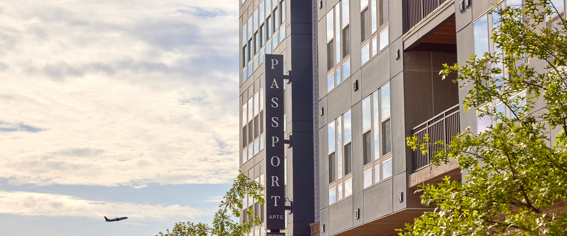 Passport Apartments | Herndon, VA | sign