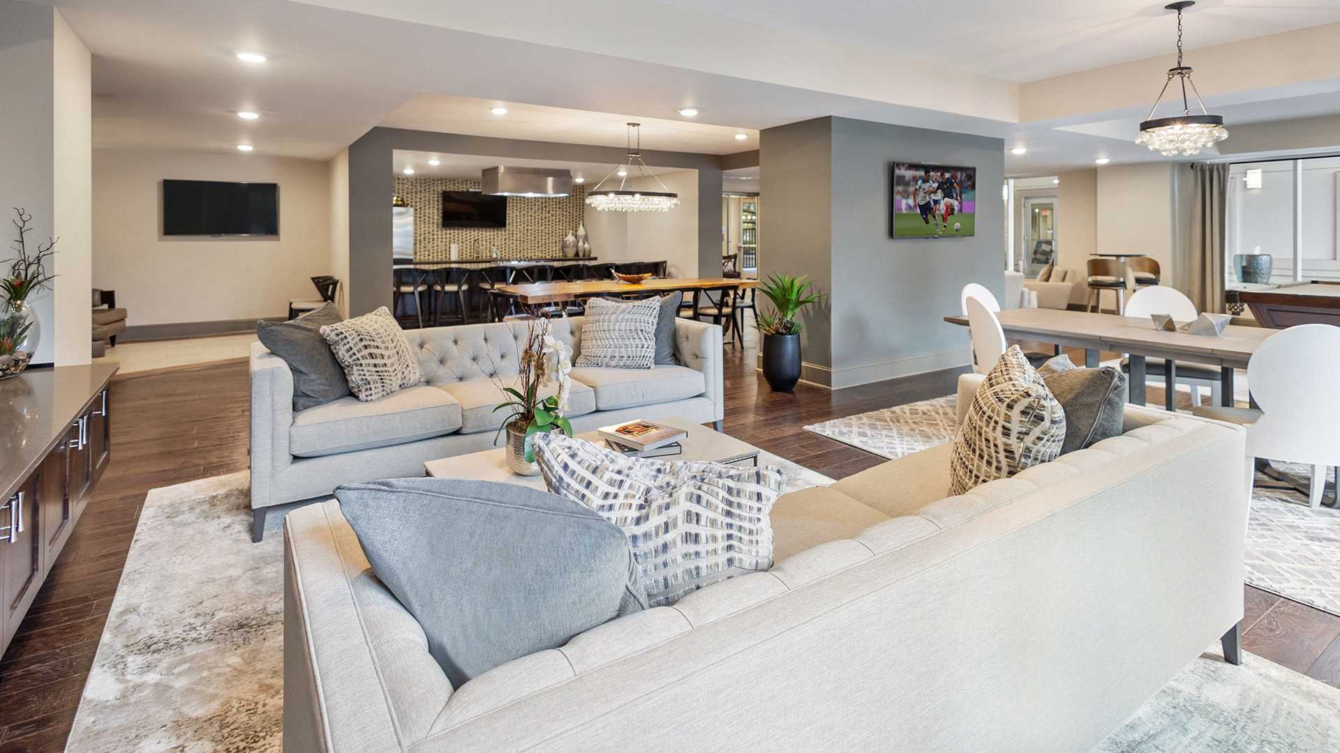 SouthPark Charlotte apartments for rent - The Encore SouthPark - resident lounge with catering kitchen TV and fireplace