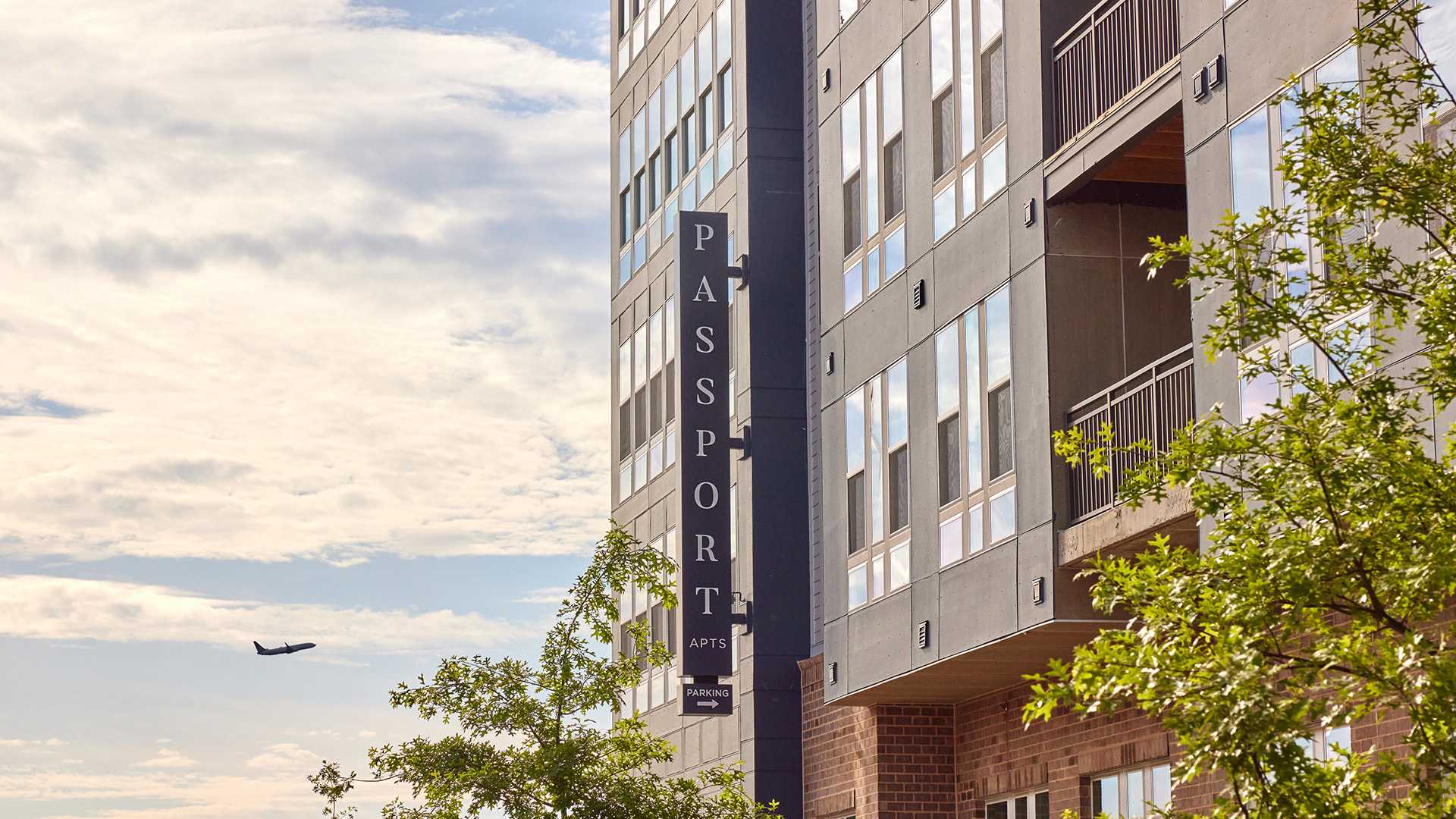 Apartments near Dulles - Passport Apartments Herndon - Exterior Signage